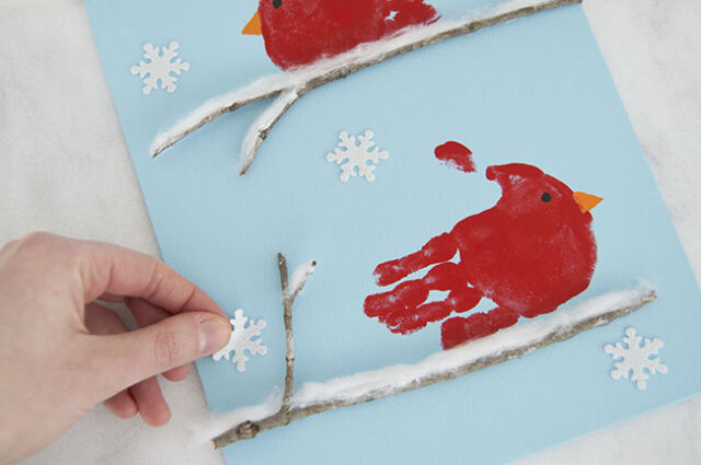 Putting on snowflake stickers